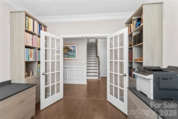 Office Flex room with Built in bookcases, cabinetry, french doors and engineered flooring