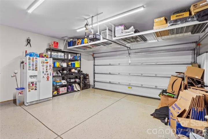 Garage with epoxy flooring, storage racks