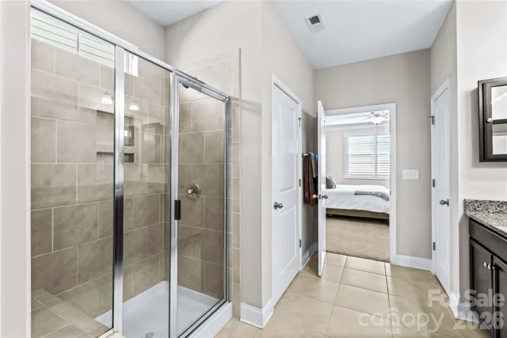 Primary Bath with walk in shower, seat and toiletry niche