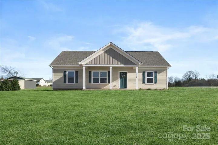 Virtually staged to show how home would look with grass fully grown.