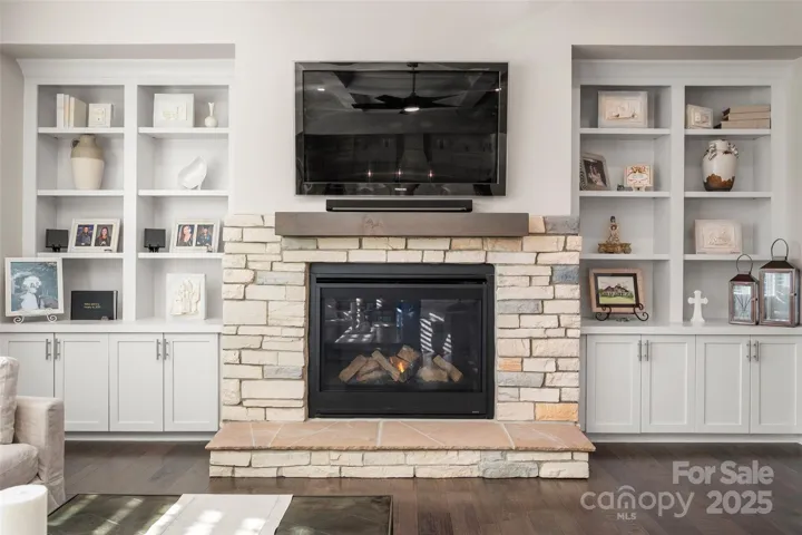 Stone fireplace with built-in cabnetry