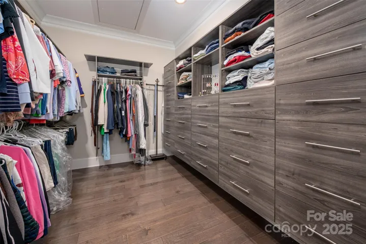 Custom closet organizer in both primary closets