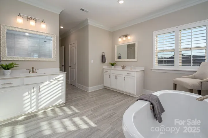 Primary bath features dual vanities