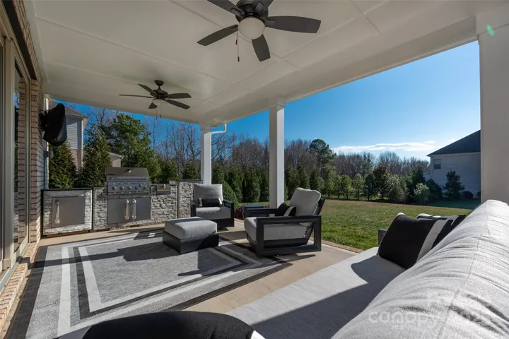 Covered patio overlooks the almost 1/2 acrea level yard.