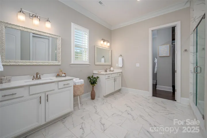 2nd primary full bath with dual vanities and lg shower