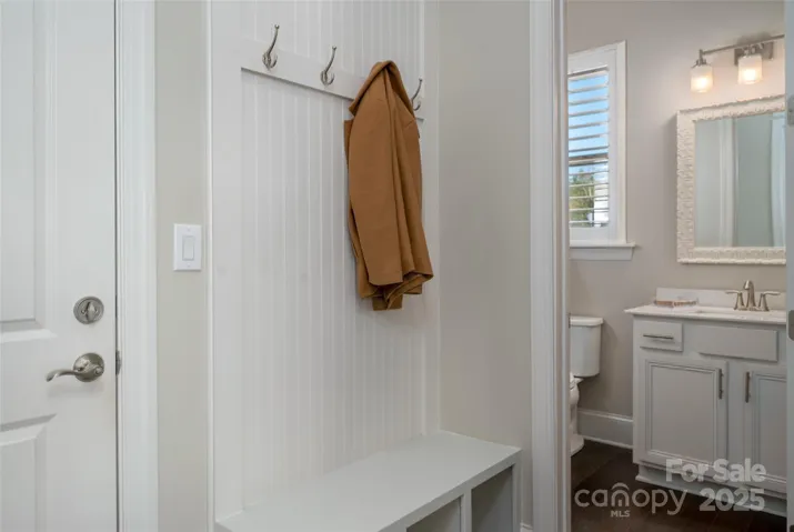 Rear entry with drop zone and powder bath