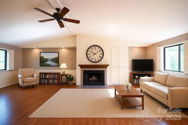 Large, bright, open living area with vaulted ceilings and gas logs. Virtually staged.