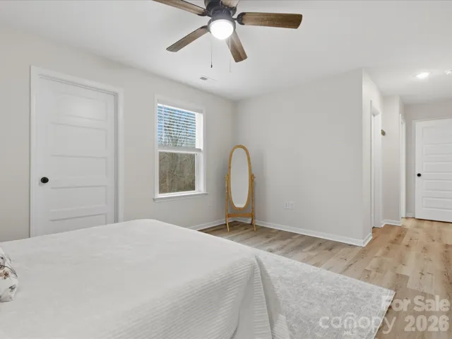 Primary suite with 2 closets and a storage room