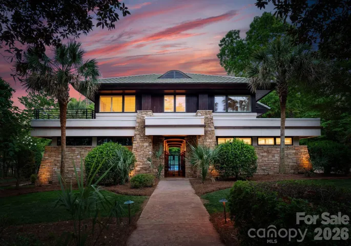 Guest house exterior at twilight. 