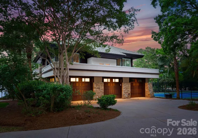 Guest house three-car garage at twilight.