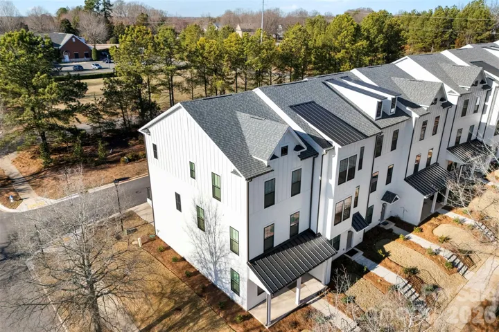 Welcome to a new townhome in Baxter Village Featuring 4 beds, 4 baths and 2 car garage on the END!
