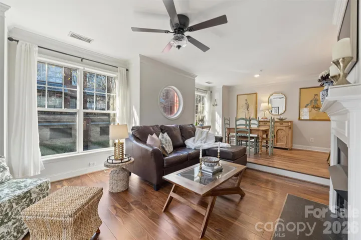 Windows galore in this gorgeous corner unit - walk to coffee & Panters Stadium!