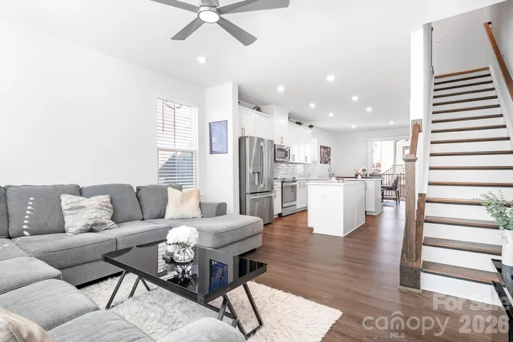 Living area with ceiling fan and lighting, all remote-controlled and adjustable