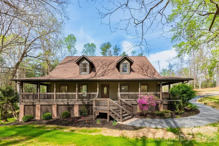 Inviting front porch entry with plenty of space for rocking chairs—ideal for enjoying morning coffee or quiet evenings outdoors.