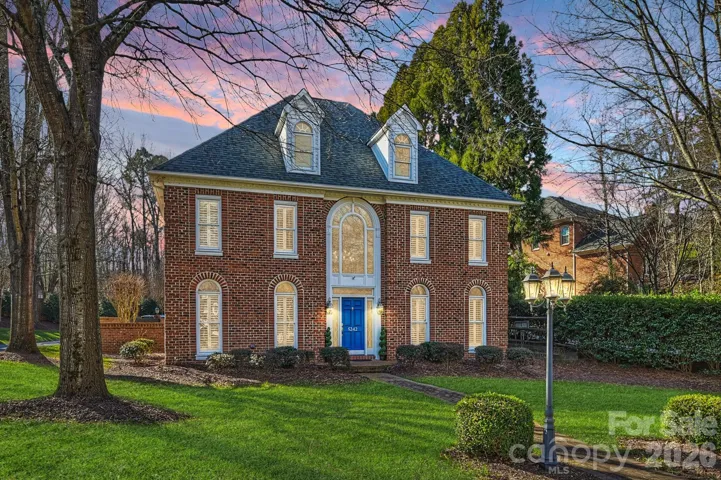 Stately all-brick exterior set behind a private entry, offering a sense of arrival just minutes from SouthPark.