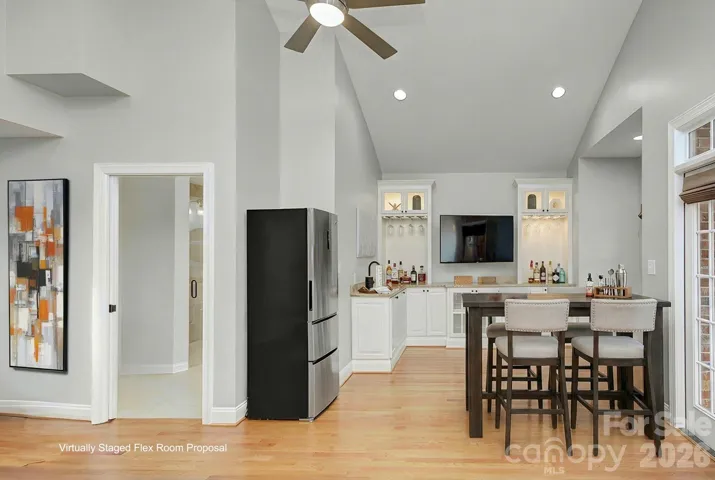 Perfect for multi-generational living or guests, this room provides comfortable main-level living options beyond a traditional bedroom use. *Shown using AI rendering suggesting use of this space as an entertainment area.