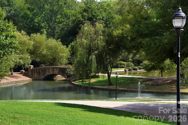 Charming stone bridge and winding waterway in Freedom Park create a peaceful setting just moments from the home.