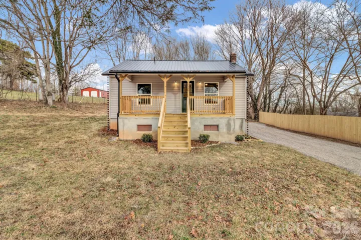 Large half acre lot with completely renovated farm house close to town.