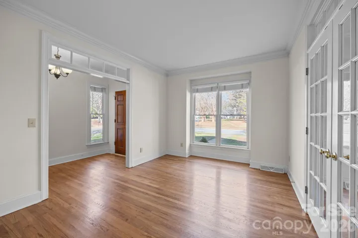 This room offers a welcoming and bright area for relaxation and gathering right off the main entry.