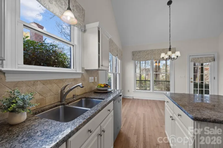 The thoughtful design element and layout with the sink positioned directly beneath a window makes the chore feel less like work and more connected to the outdoors.