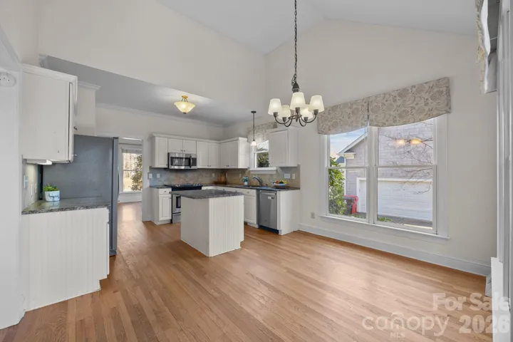 This is a large, beautifully designed kitchen that truly serves as the culinary and social hub of the home.