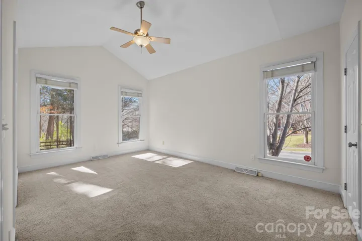 This is a luxurious and serene primary suite, designed as a true retreat within the home. 