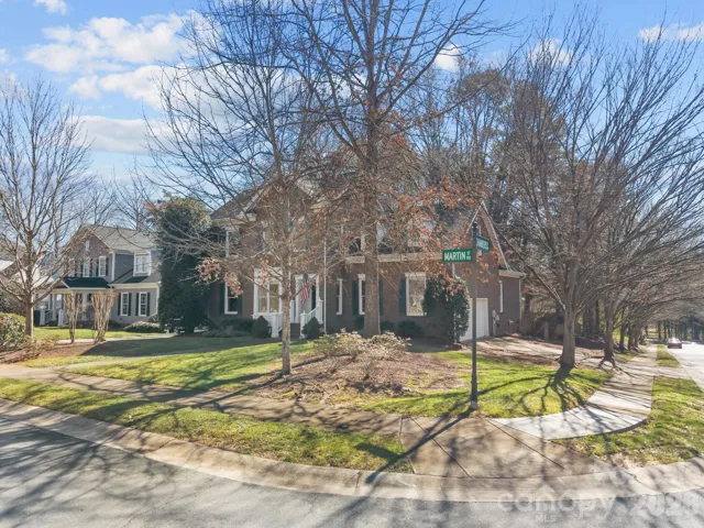 The corner lot itself is notable, presenting a stately and traditional aesthetic.