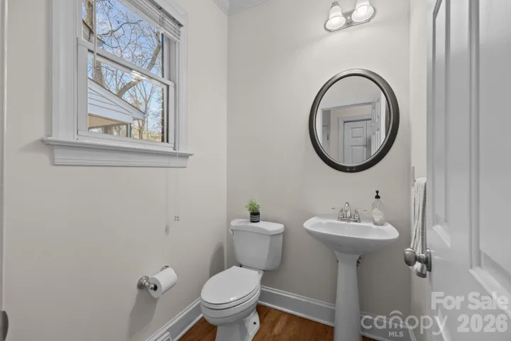 This fresh powder bathroom is wonderfully light-filled, creating a bright and clean space for guests. 