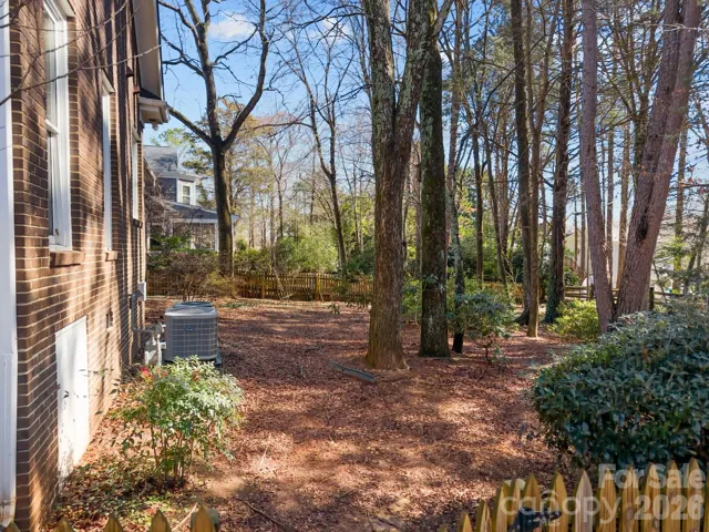 The backyard supplies a natural area with wooded views which provide a stunning, private, park-like setting. 