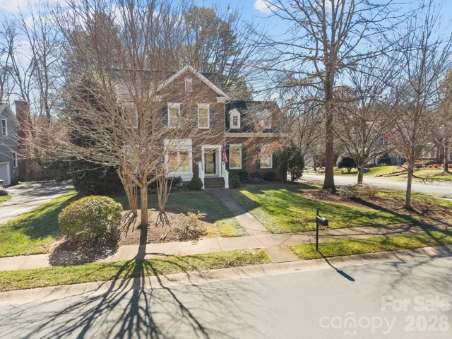 This home is perfectly situated on a large, flat lot, which enhances its curb appeal and provides maximum usability for the entire property.