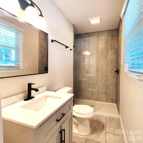 Primary bathroom has tile floors and large walk-in shower!