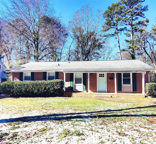 Welcome home! This cute brick ranch home has a covered front porch and sits on .25 acres!