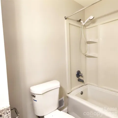 Hall bath has shower/tub combo.