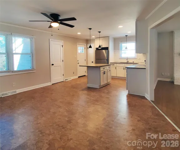 Plenty of windows and light fixtures for a bright kitchen and dining space!