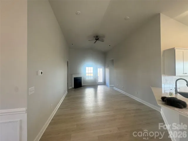 Spacious family room with cathedral ceiling and fire place
