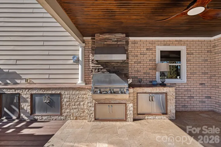 Covered outdoor grilling station with additional storage areas for all your outdoor supplies.