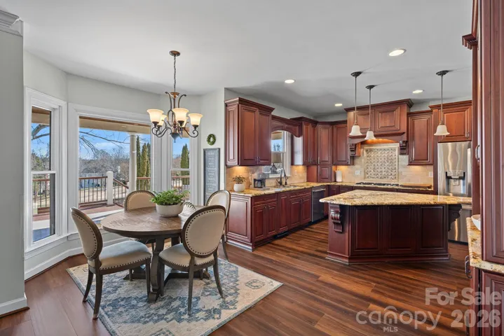 Spacious Eat In breakfast area adjacent to the beautiful high end kitchen.