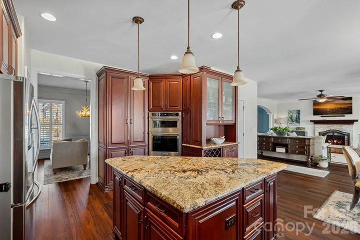 Abundance of Custom Cabinetry, large island for meal prep, and Stainless Steel appliances.