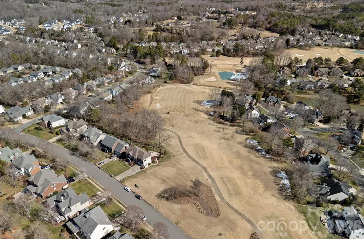 View of 15910 Northstone Drive, Huntersville-Northstone Golf Course.  This picture shows the home and the common area to the right of the home and the golf course view.