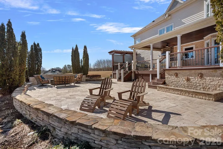 Expansive outdoor patio with water feature.