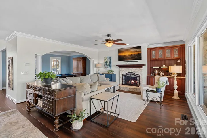 Great Room also features hardwood flooring, new gas log fireplace with stone surround and built in cabinetry.