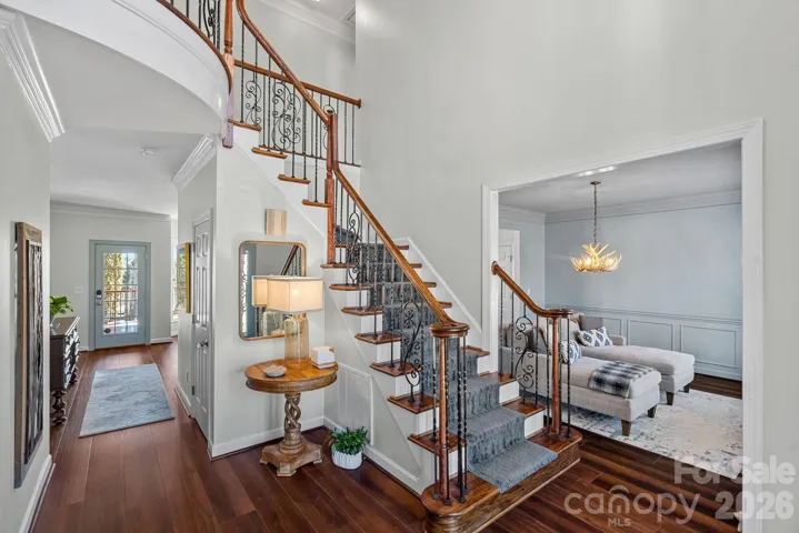 Stunning hardwood flooring and upgraded balusters compliment the foyer enterance.