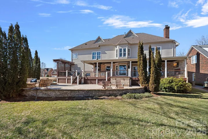 Beautiful view of the back of the home and yard.