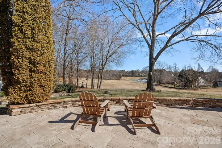 Oversized travertine patio looking over pristine Golf course views.
