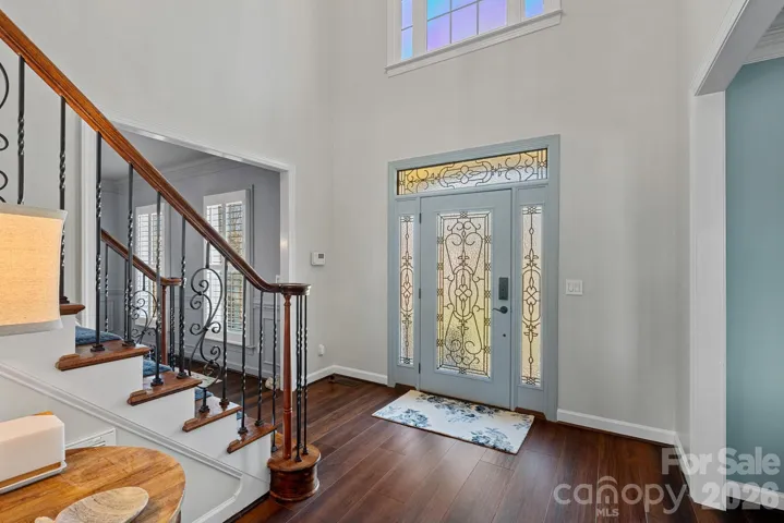 Open and bright foyer with hardwood flooring.