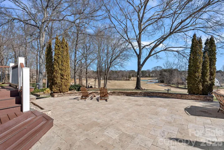 Oversized entertaining travertine tiled patio overlooking the Golf Course.