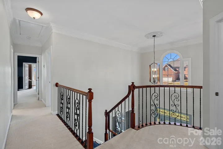 Open Concept floorplan upstairs with lots of light and a grand staircase.