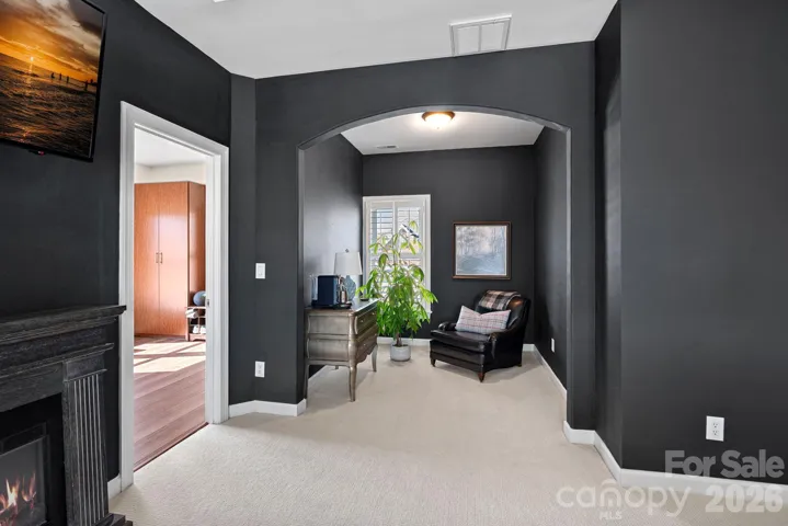 Primary Suite with a cozy sitting area that can be used for multiple flex space areas for this spacious room.