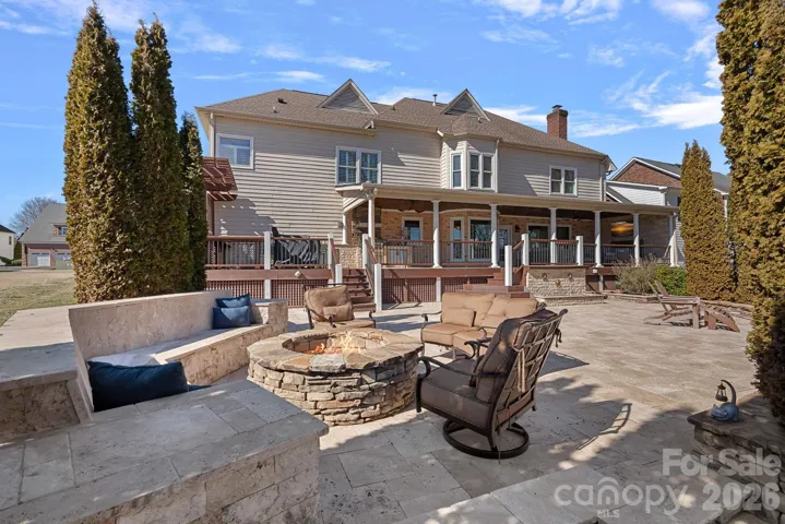 Custom privacy seating and walls around the firepit sitting area.