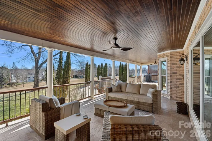 Covered outdoor living space over looking the golf course.